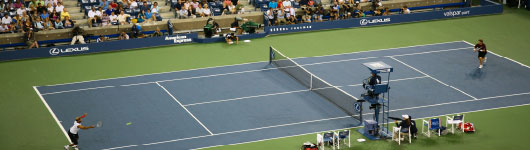 James Blake Returns a Serve at the US Open in Arthur Ashe Stadium